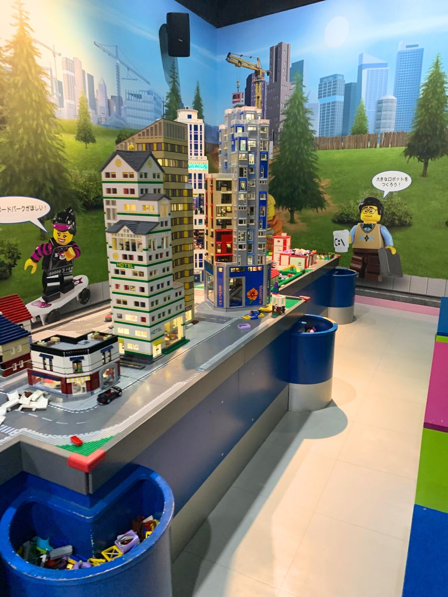 The City Builders area with its shared LEGO city of towers and roads