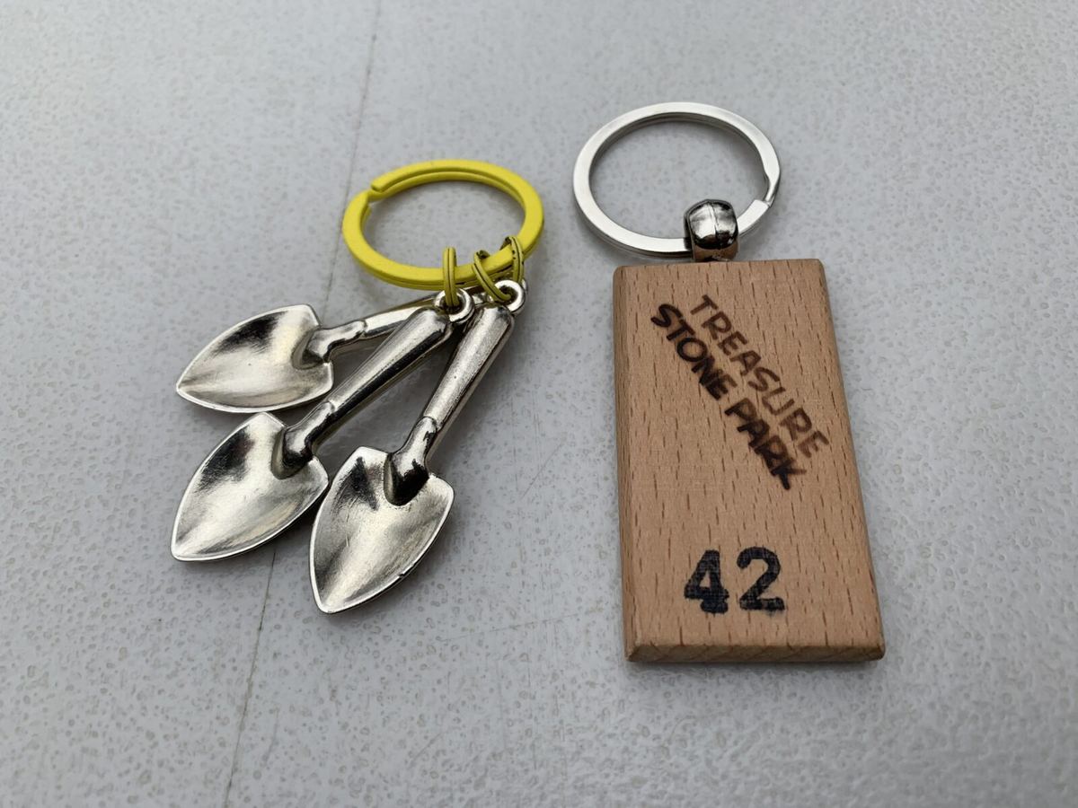 Mini shovels and the numbered keychain tag you receive at signup